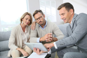 46410940 - financial adviser showing terms of contract on tablet