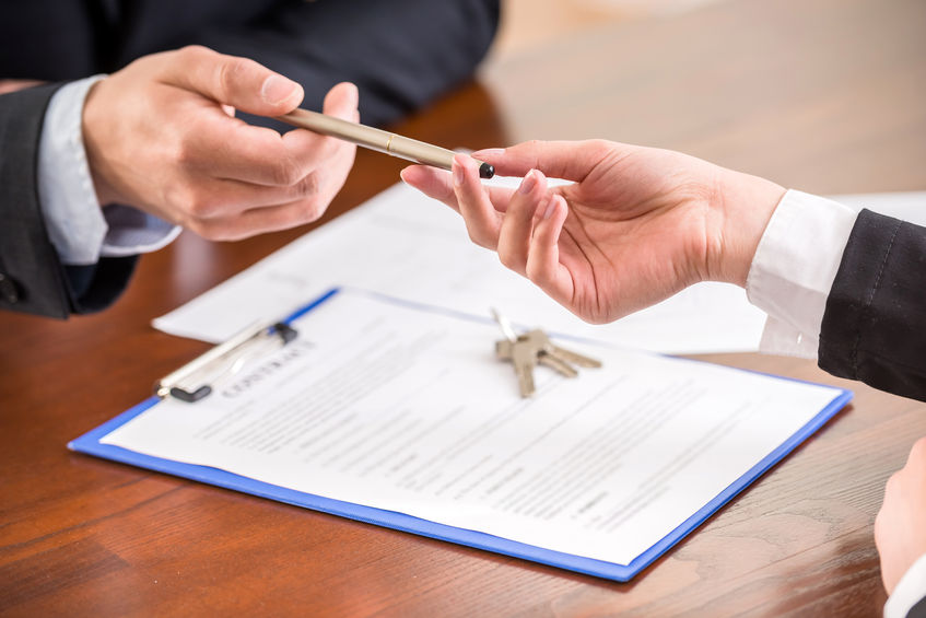 39395923 - close-up of hands with a pen to signing a contract.