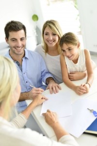 24533152 - family signing contract with home seller