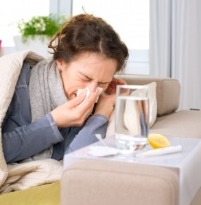 16443971 - sick woman flu woman caught cold  sneezing into tissue